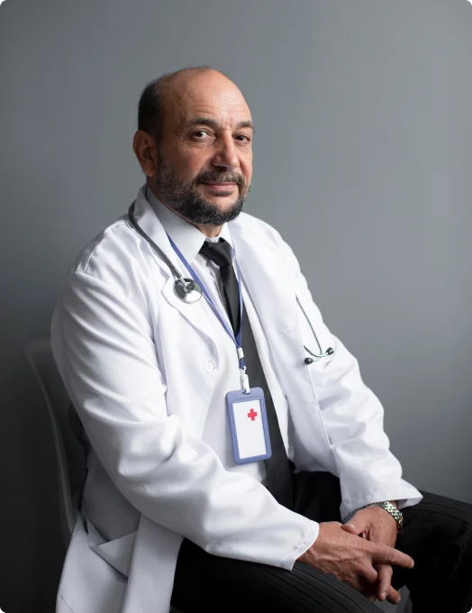 smiling doctor with a stethoscope around his neck